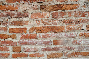 Old red bricks wall for background.