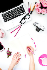 The female hands writing against fashion woman objects
