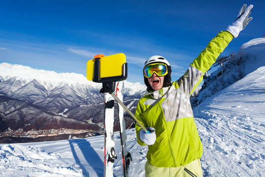 Happy screaming woman taking selfie on mountain