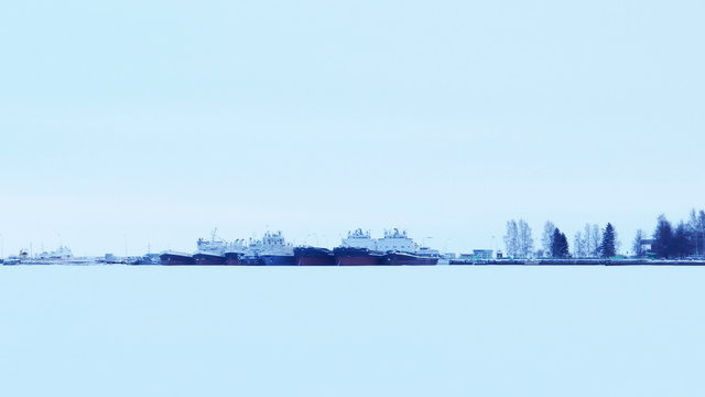 Port on a Frozen Lake with Barges in Ice, Petrozavodsk, Russia