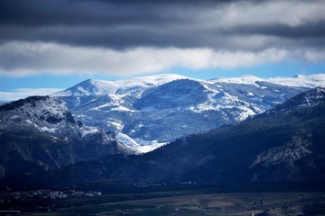 snowy mountains , peaks and clouds