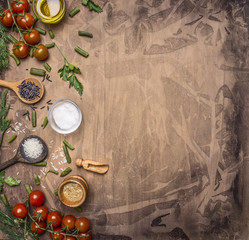 Ingredients for cooking vegetarian food cherry tomatoes, wild rice, spices, salt border ,place for text  on wooden rustic background top view close up