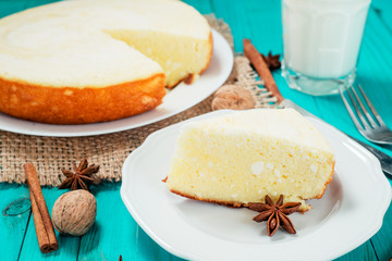 
pastries, desserts , curd pudding with milk,cottage cheese casserole , cinnamon and nuts on a wooden background