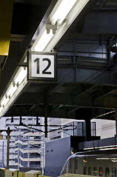 Twelve number label on the train station platform.