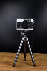 vintage camera and tripod,concept image