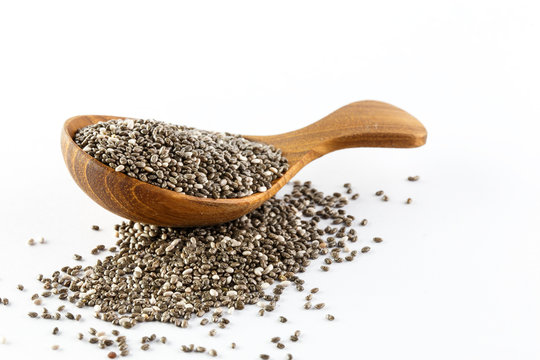 chia seeds in wooden spoon , Isolated on white background