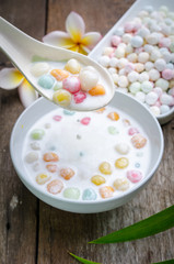 Colorful candies dumplings in coconut cream