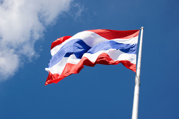 Fototapeta premium Flying the Thailand flag on pole and blue sky background