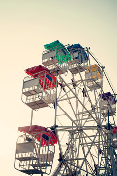Ferris wheel and sky with retro filter effect (vintage style)