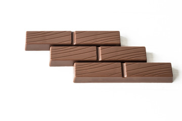 Three chocolate bars on white background 