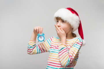 Little girl with a clock