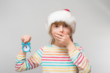 Little girl with a clock