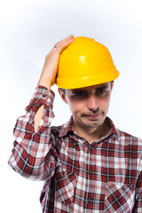 Worker in yellow helmet upset