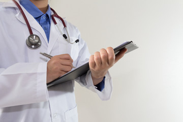 Doctor writing a medical prescription