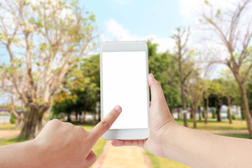 Woman hand touching smartphone in park concept