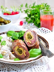 Roulade of beef stuffed with bacon, scrambled eggs, pickled cucumbers garnished with mushrooms stewed in sour cream.