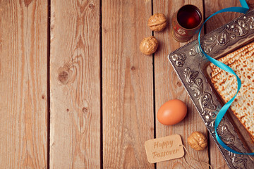 Passover background with matzo, wine and egg. View from above