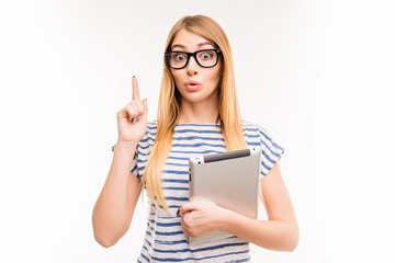 Girl in glasses with tablet having an idea