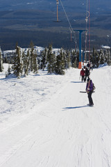 Fototapeta na wymiar riding a ski resort t-bar lift