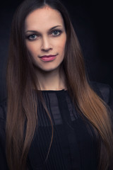 Fototapeta premium beautiful young woman on a dark background