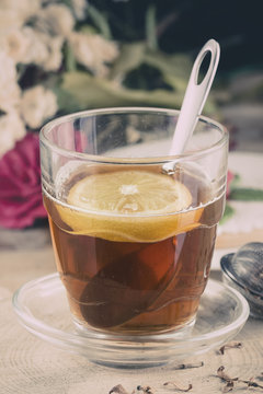 Cup of tea with lemon in the afternoon in a rustic style.