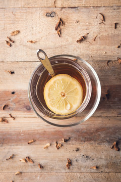 Cup of tea with lemon in the afternoon in a rustic style.