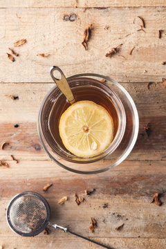 Cup of tea with lemon in the afternoon in a rustic style.