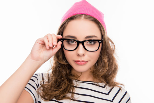 Close up photo of pretty girl in hat touching her glasses