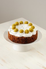 Simnel, english Easter cake in white stand on white table