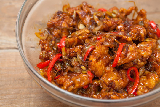 Chinese food, fried chicken with vegetables in spice source