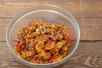 Chinese food, fried chicken with vegetables in spice source