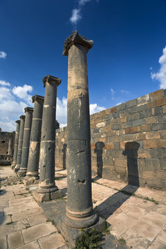 Syria. Bosra. The remains of the Roman baths - basalt columns. This site is on UNESCO World Heritage List