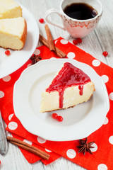 
pastries, desserts , curd pudding with milk,cottage cheese casserole , cinnamon and red strawberry or cherry jam on a wooden background