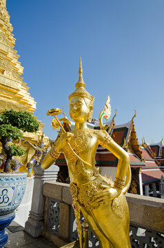 A Golden Kinnari statue at  the Temple of the Emerald Buddha (Wat Phra Kaew) , Bangkok, Thailand