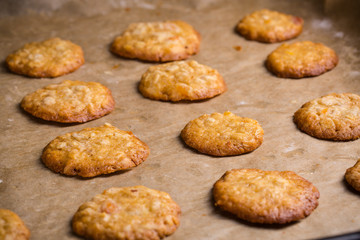 Tasty homemade oat cookies on baking tray.
