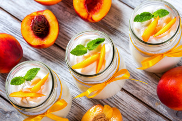delicious homemade yogurt with pieces of peach, top view