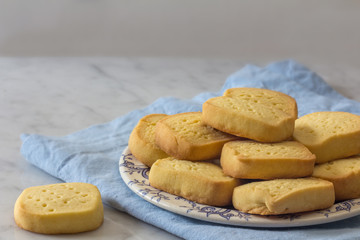 Plate of Homemade Shortbread on Plate with Blue Napkin Horizontal