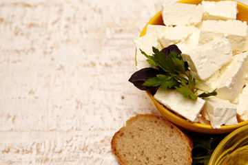 
healthy food. cottage cheese and bread on a white wooden background