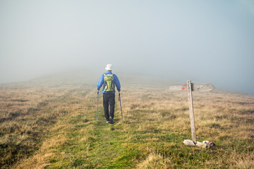 Man loosing his path in the fog