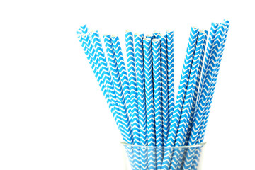 Striped drink straws on a white background