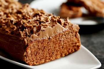 Chocolate cake on a black wooden background