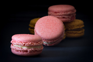 Pink Macarons Stacked with Dark Back Ground