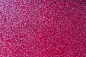 Fototapeta premium contrastly lit crimson plastered painted wall