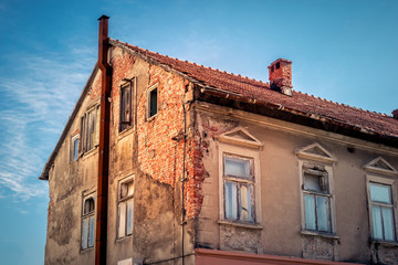 Decrepit facade of the old brick house