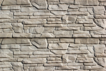 Abstract weathered texture stained old flaking stucco light gray and white concrete wall background, grungy blocks of stonework technology architecture wallpaper