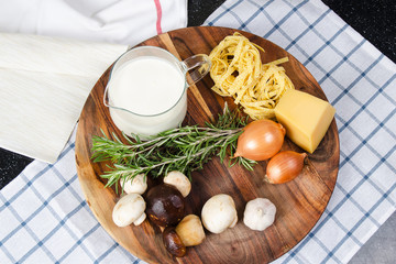 Ingredients pasta tagliatelle  with mushrooms
