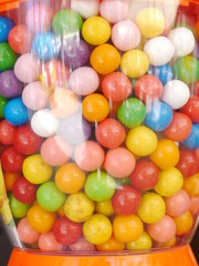 Fototapeta na wymiar lot of gummy balls in a gummy ball machine 