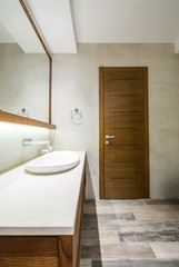 Fototapeta na wymiar Lavatory and mirror in modern bathroom interior