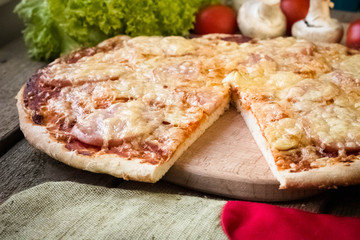 sliced pizza with sausage and onion