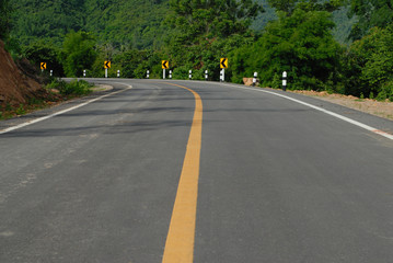 road signs warn for ahead dangerous curve